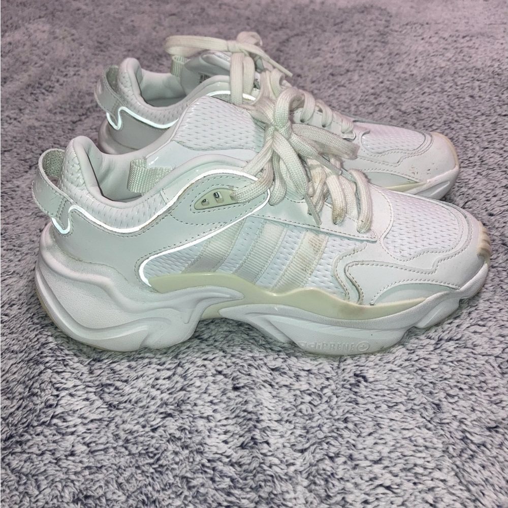 White adidas sneakers.